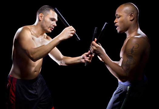 amateur student learning kali escrima martial arts from instruc