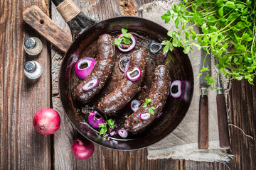Hot black pudding with onion and parsley