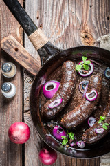 Tasty black pudding with parsley and onion
