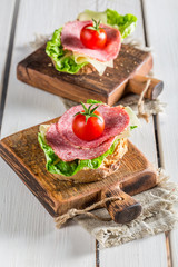 Fresh salami with tomato and lettuce