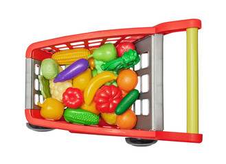 The childish plastic cart with plastic vegetables and fruit
