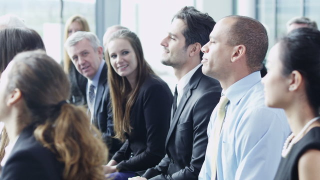 Diverse group of business people attend a business seminar