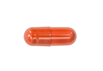 Macro red medical pill tablet isolated on white