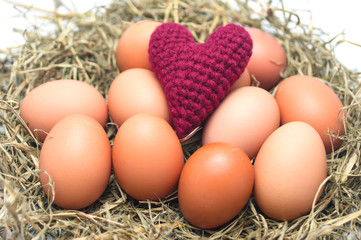 pink Heart Yarns on eggs in the nest. Heart health