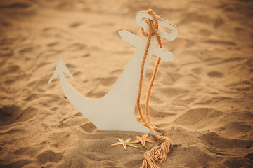 child anchor on the sand