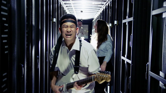 IT engineers rocking out in a data center