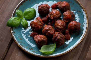 Close-up of meatballs with tomato sauce, selective focus