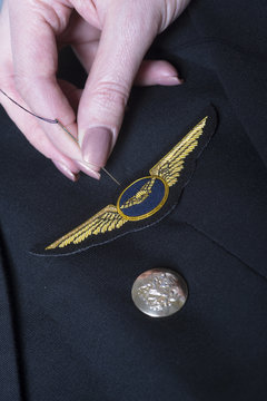 Sewing wings onto a uniform jacket
