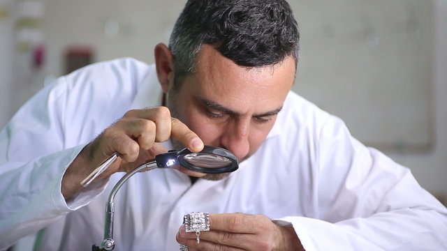 Jeweler In His Studio Working With Diamonds