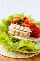 Lettuce wrapped chicken fajitas served  on a flour tortilla