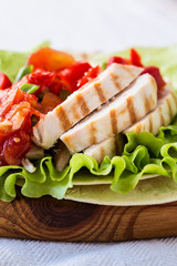 Lettuce wrapped chicken fajitas served  on a flour tortilla