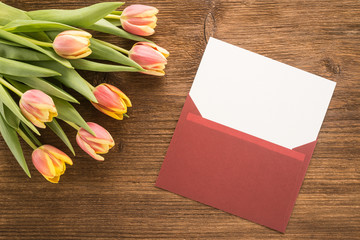 Flowers and envelope on the table