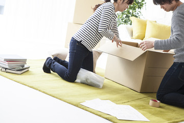 Couple are packed in a cardboard box