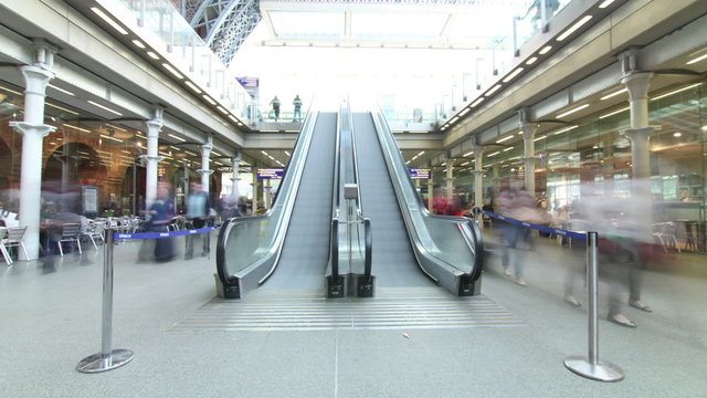 Time lapse of travelers and commuters passing through a London railway station