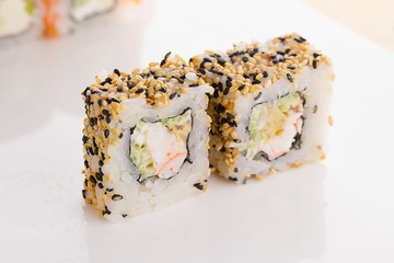 Sushi roll on white plate