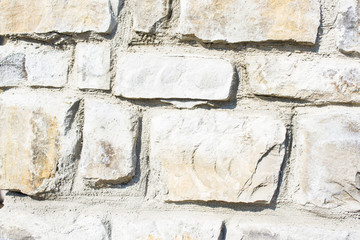 construction of a wall made of natural stone