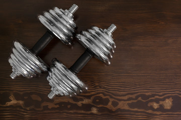 dumbbells on wooden table