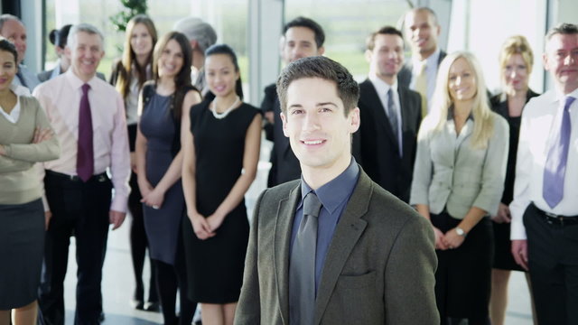 Attractive diverse business team in a light modern office building