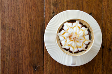 A cup of coffee with flower pattern