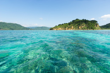 Fototapeta premium Tropical Beach paradise getaway lagoon with beautiful clear blue turquoise water and white sand, Okinawa