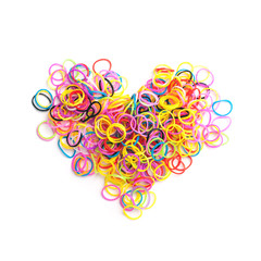 Small round colorful rubber bands in heart shape