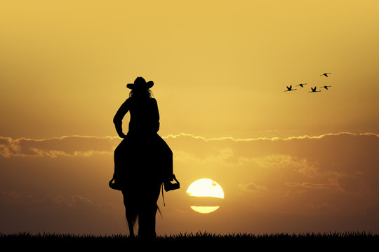Cowgirl at sunset