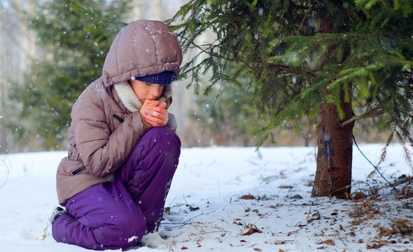 Sad Freezing Girl Trying To Stay Warm In Winter Forest