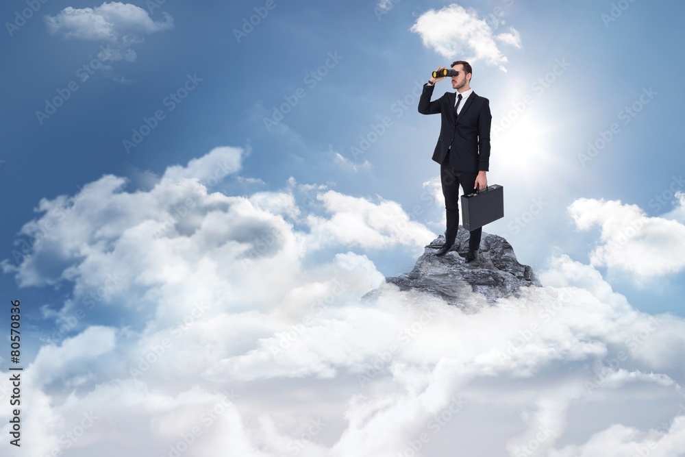 Poster businessman holding a briefcase while using binoculars