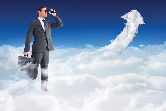 Composite image of businessman looking through binoculars - Powered by Adobe