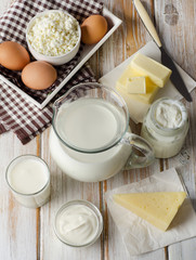 Milk products on  wooden table.