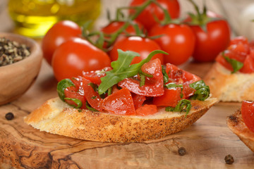 Bruschetta with tomatoes and arugula