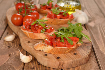 Bruschetta with tomatoes and arugula