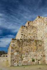 Fototapeta na wymiar Mexico Oaxaca Monte Alban pyramide wall and sky