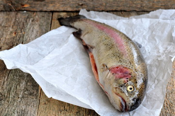 Fresh raw salmon with vegetables on a white background