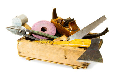 Working tools (axe, chisel, plane and others) in an old box on