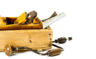 Working tools (drill, scissors and others) in an old box on