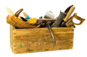 Working tools (pliers, chisel, plane and others) in an old box