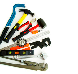 Many working tools - saw, axe, pliers and others on white