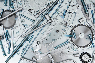 Fototapeta premium Many tools on the scratched metal background.