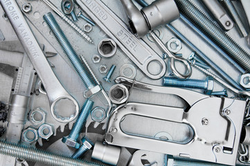 Many tools on the scratched metal background.