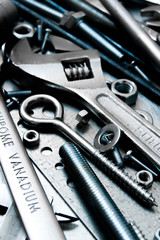 Fototapeta premium Wrench and tools on the scratched metal background.