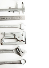 Metalwork. Ruler, caliper and others tools on white background.
