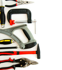 Many working tools - clamp, hammer and others on white