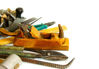 Vintage working tools ( drill, saw and others) on white