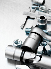 Wrench with a set of heads and other tools on the scratched