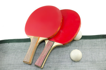 Two red table tennis rackets and a net isolated