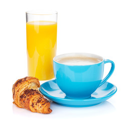 Cup of coffee, orange juice and fresh croissant