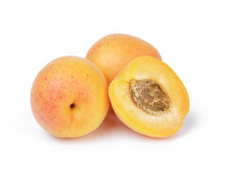 Naklejka na ściany i meble three ripe apricot fruits one half sliced isolated