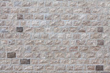 house wall faced with stone tiles