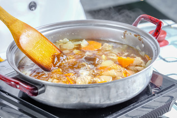 chef filling curry cube